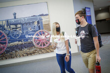 Students carrying their coffee as they cross throught the Union to get to class. Students inside the