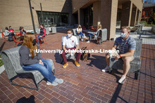 Students sit on the new patio along the south side of the Nebraska East Union. East Campus photo sho