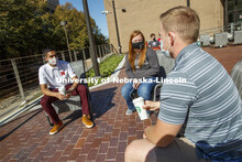 Students sit on the new patio along the south side of the Nebraska East Union. East Campus photo sho