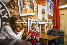 Students enjoy ice cream while social distancing inside the Dairy Store. East Campus photo shoot. Oc