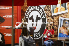 Students enjoy ice cream while social distancing inside the Dairy Store. East Campus photo shoot. Oc