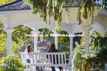 Students enjoy the afternoon on Perin Porch on east campus. East Campus photo shoot. October 13, 202