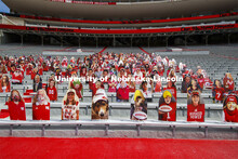 Cardboard cutouts of fans fill the stands in Memorial Stadium. Cornhusker Marching Band, Cheer Squad