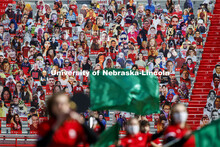 Cardboard cutouts of fans fill the stands in Memorial Stadium. Cornhusker Marching Band, Cheer Squad