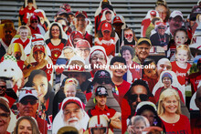 Cardboard cutouts of fans fill the stands in Memorial Stadium. Cornhusker Marching Band, Cheer Squad