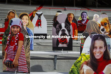 Cardboard cutouts of fans fill the stands in Memorial Stadium. Cornhusker Marching Band, Cheer Squad