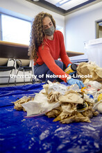 Morgan Hartman sorts waste in an Andersen Hall classroom. The waste audit was performed on trash sav