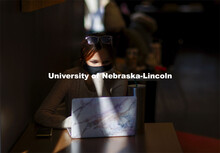 Emily Diesing, a sophomore from Omaha, studies in a ray of afternoon sunshine in the Nebraska Union.