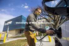 Dan Carpenter, Director of Parking and Transit Services, plugs in a Chevy Bolt to charge at the new 