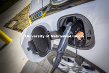 A Chevy Bolt charges at the new charging station in front of Howard Hawks Hall. There are four new c