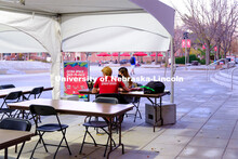 Students study outside of the Nebraska Union under the tents installed to help with social distancin