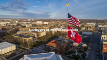 With the campus as the background, The United States and Husker flags fly on a sunny Friday afternoo