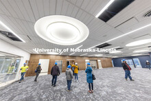 Regina Flowers points out features during a tour of the remodeled C.Y. Thompson Library on East Camp