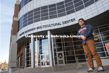 Fernando Wisniewski-Pena in front of the Jackie Gaughan Multicultural Center for a graduation story.