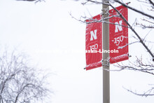 An N 150 Banner is covered in snow. Snow on UNL City Campus. December 12, 2020. 