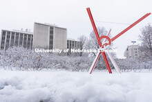 Old Glory is covered in snow. Snow on UNL City Campus. December 12, 2020. 