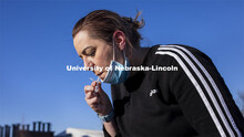 Jessica Calvi, a research assistant professor with the Nebraska Athletic Performance Lab, demonstrat