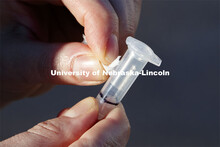 Jessica Calvi, a research assistant professor with the Nebraska Athletic Performance Lab, demonstrat