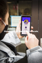 Taylor Daum shows the Safer Community app to be used as part of COVID testing on campus this spring.