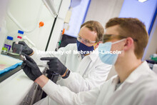 Ryan Pedrigi, Assistant Professor in Mechanical and Materials Engineering, works with T.J. Ripperda,
