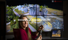 Christine Wittich, assistant professor in Civil and Environmental Engineering, holds a damaged ancho