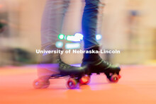A student skates around in a circle before more students enter the skating area during the Club 80 R