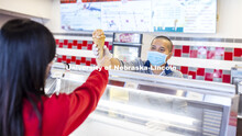 Duy Nguyen serves up a cone of his favorite flavor, Butterscotch Frost. Duy Nguyen is the manager of