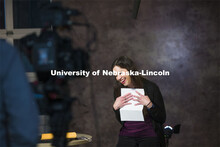 Karen Wills, University Program Council Nebraska Program Coordinator, reacts while reading a letter 
