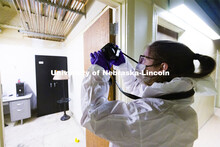 Ryen Manning takes photos before the CSI team enters the mock crime scene. Forensic Science 485 is t