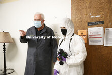 Professor Larry Barksdale asks a question to Alysa Ehlers in the mock crime scene. Forensic Science 