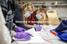 Students work on their notes before taking their evidence to the lab. Forensic Science 485 is the ca