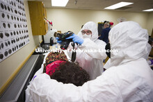 Ryen Manning photographs the victim. Forensic Science 485 is the capstone for the seniors. The CSI o