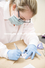Karen Avery writes on a sock which has a spot which appears to be blood and will be tested by the se
