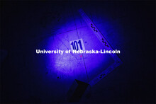 An unknown body fluid glows in the light of an ultraviolet flashlight in the mock crime scene. Foren