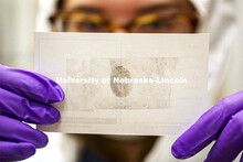 Ryen Manning holds a fingerprint lifted off the victim. Forensic Science 485 is the capstone for the