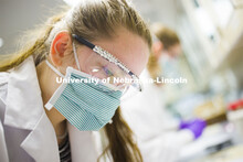 Lauren Gipson works on evidence wearing her rhinestone decorated goggles. Forensic Science 485 is th