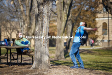 Benjamin Janssen, a sophomore from Marquette, NE, reacts to how good the sunshine feels while talkin