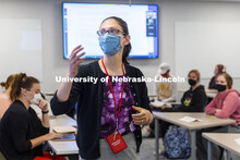 Maria Benes, faculty affiliate with the Honors Program and course instructor, discusses the day’s 