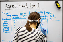 The waste is broken down by category Environmental Studies Orientation students work on a waste audi