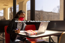 Gabriella Silva studies at a table in the sun lit lobby inside Hamilton Hall. March 30, 2021. 