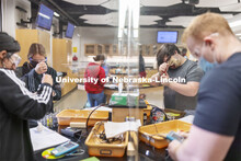 Students perform spectral analysis on colored liquids in the chemistry 109 lab. Chemistry Labs in Ha