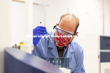 Pat Dussault practices loading samples into the auto sampler on the high-field NMR (nuclear magnetic
