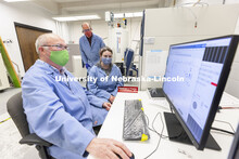 Dan Draney, Pat Dussault, and Michelle Takacs look over results from the Research Instrumentation Fa