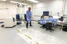 Pat Dussault, Michelle Takacs and Dan Draney look over results from the Research Instrumentation Fac