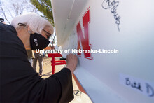 Marjorie Kostelnik, professor for Child, Youth, and Family Studies at CEHS, adds her signature to th