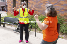Jane Green cheers with a vaccinated person leaving the clinic Friday afternoon. Chancellor Ronnie Gr