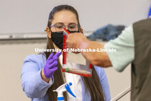 Lauren Gipson is handed an evidence bag as she testifies on evidence she tested. Forensic Science 48