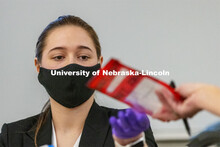 Gabby Smith is handed an evidence bag as she testifies on evidence she tested. Forensic Science 485 