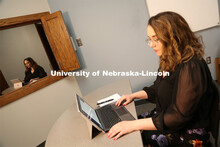 Brenna Lash, a graduate student in the Clinical Psychology Training Program, loads the telehealth pl