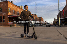 Koo Sheng Jit, a junior in management, poses in the Haymarket for an ASEM recruitment story. April 1